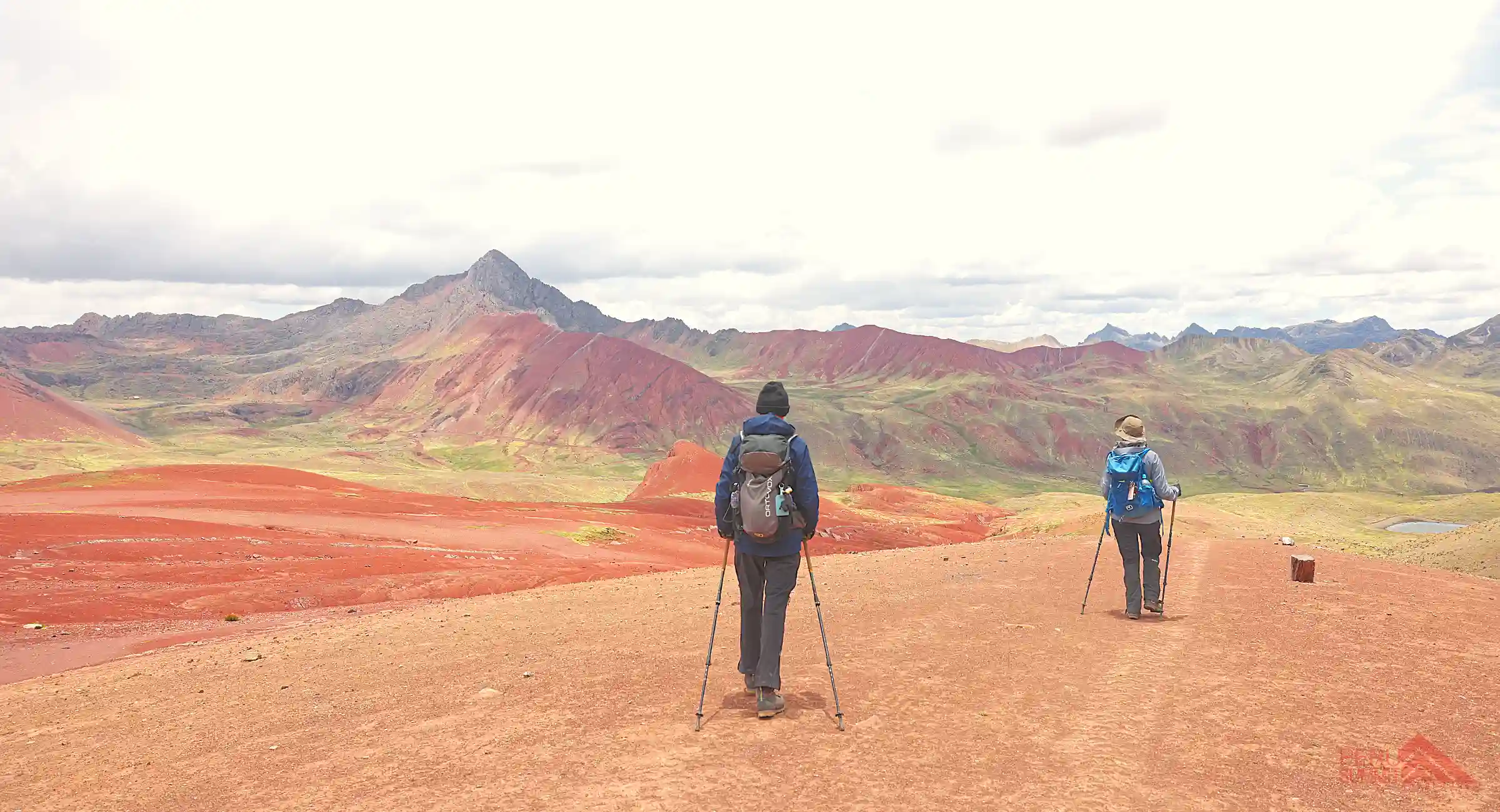 hikers in the red Valley on the Machu Picchu and Rainbow Mountain Tour